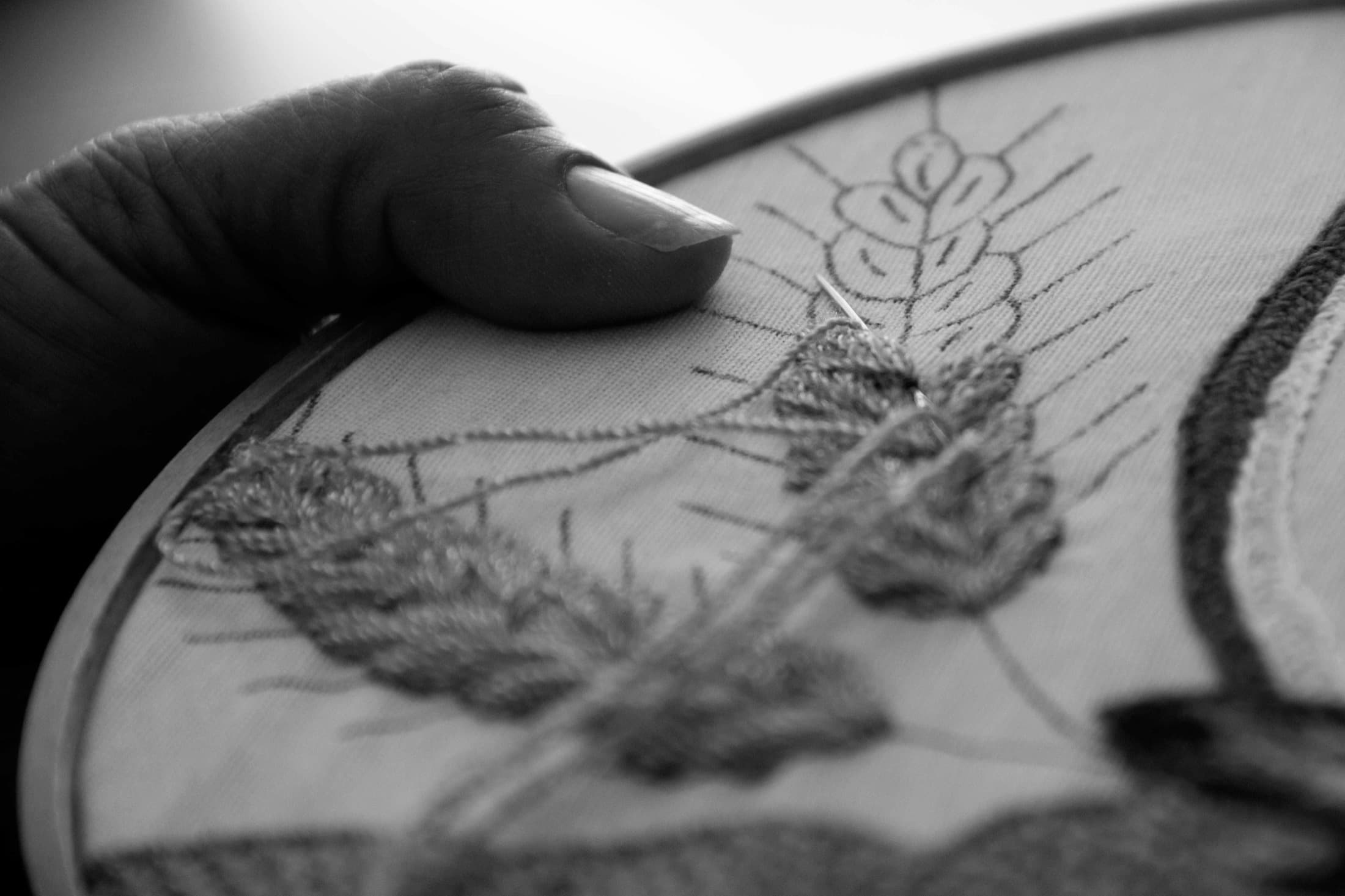 Machine detail showing a streamlined fashion-tech embroidery workflow